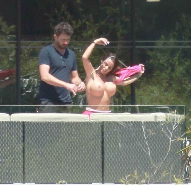 Katie Price Topless Taking off her Pink Bikini Top free nude pictures