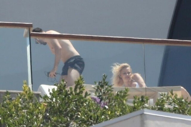 Pam Anderson Nipple Slip While Sunbathing in White Bikini free nude pictures