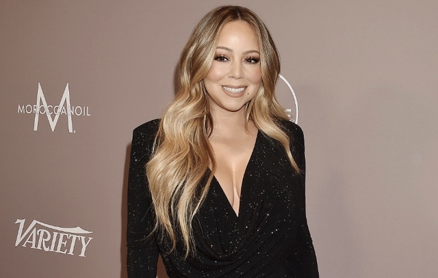 Mariah Carey Shows Cleavage in a Morticia Addams Dress free nude pictures